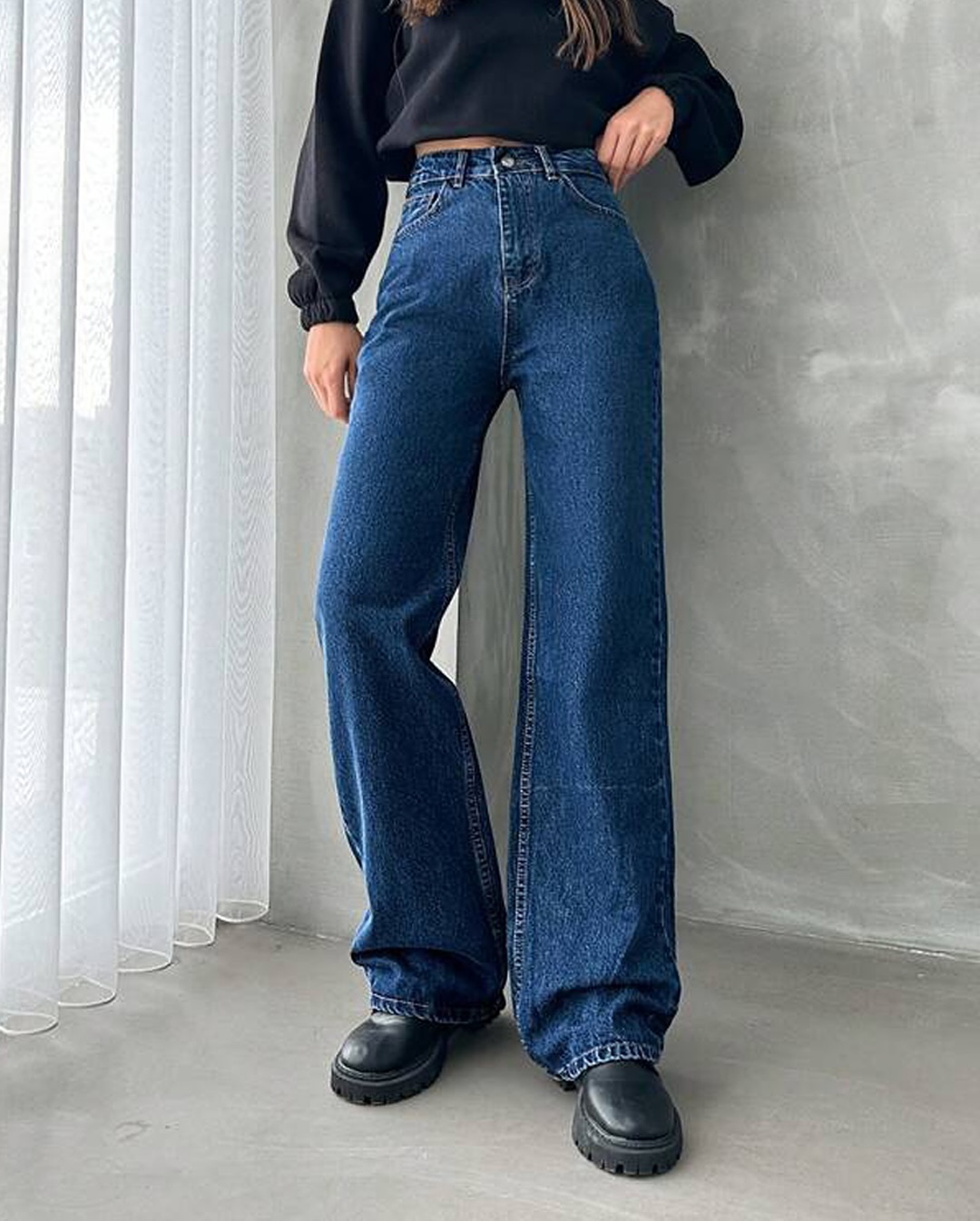 Stylish girl in loose baggy jeans ensemble