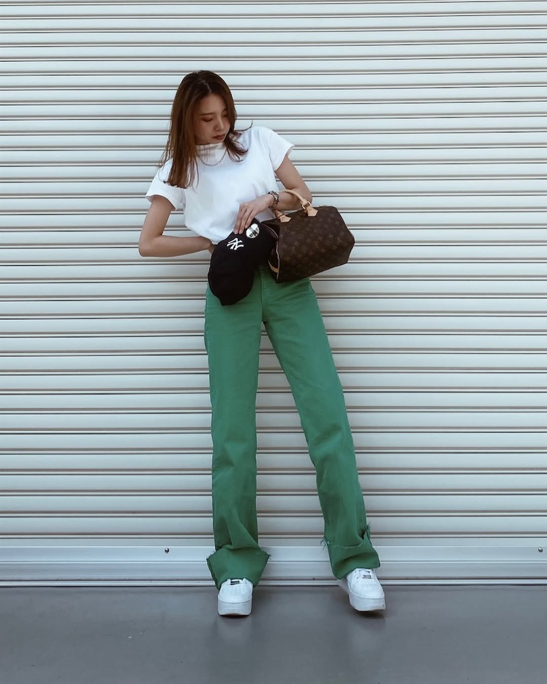 Chic green pants with a casual white tee