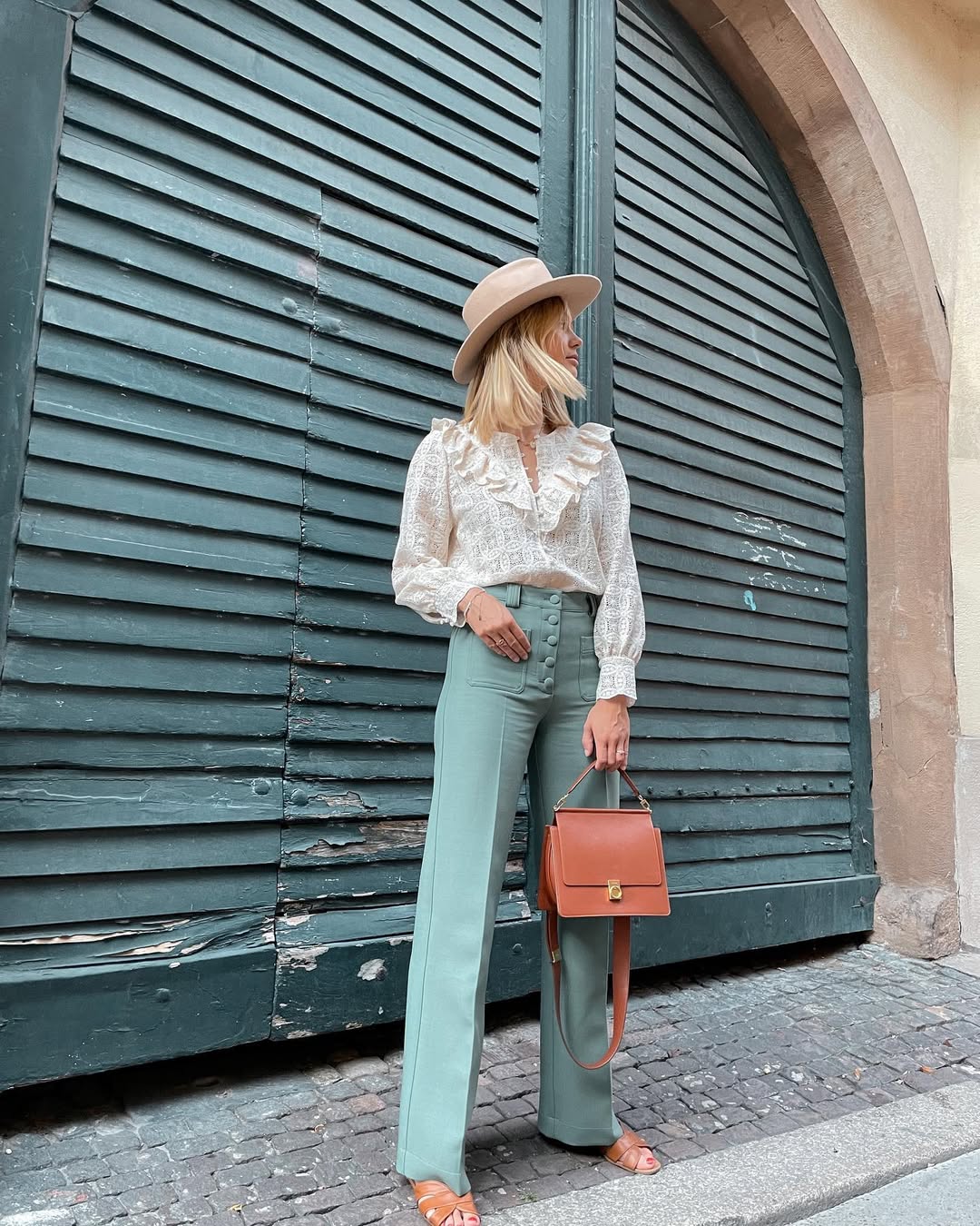 Elegant green pants with blouse and accessories