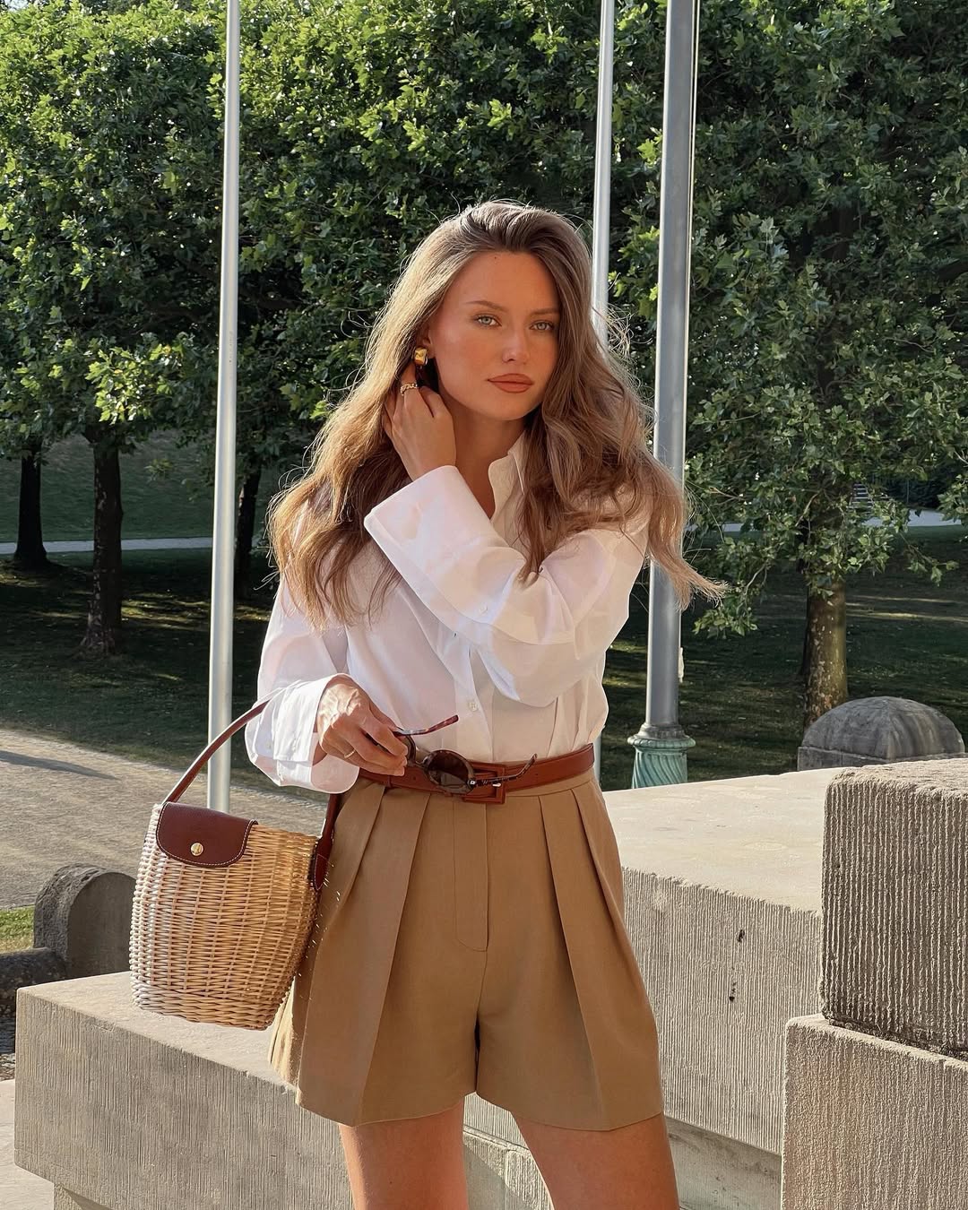 Chic white blouse with tailored shorts