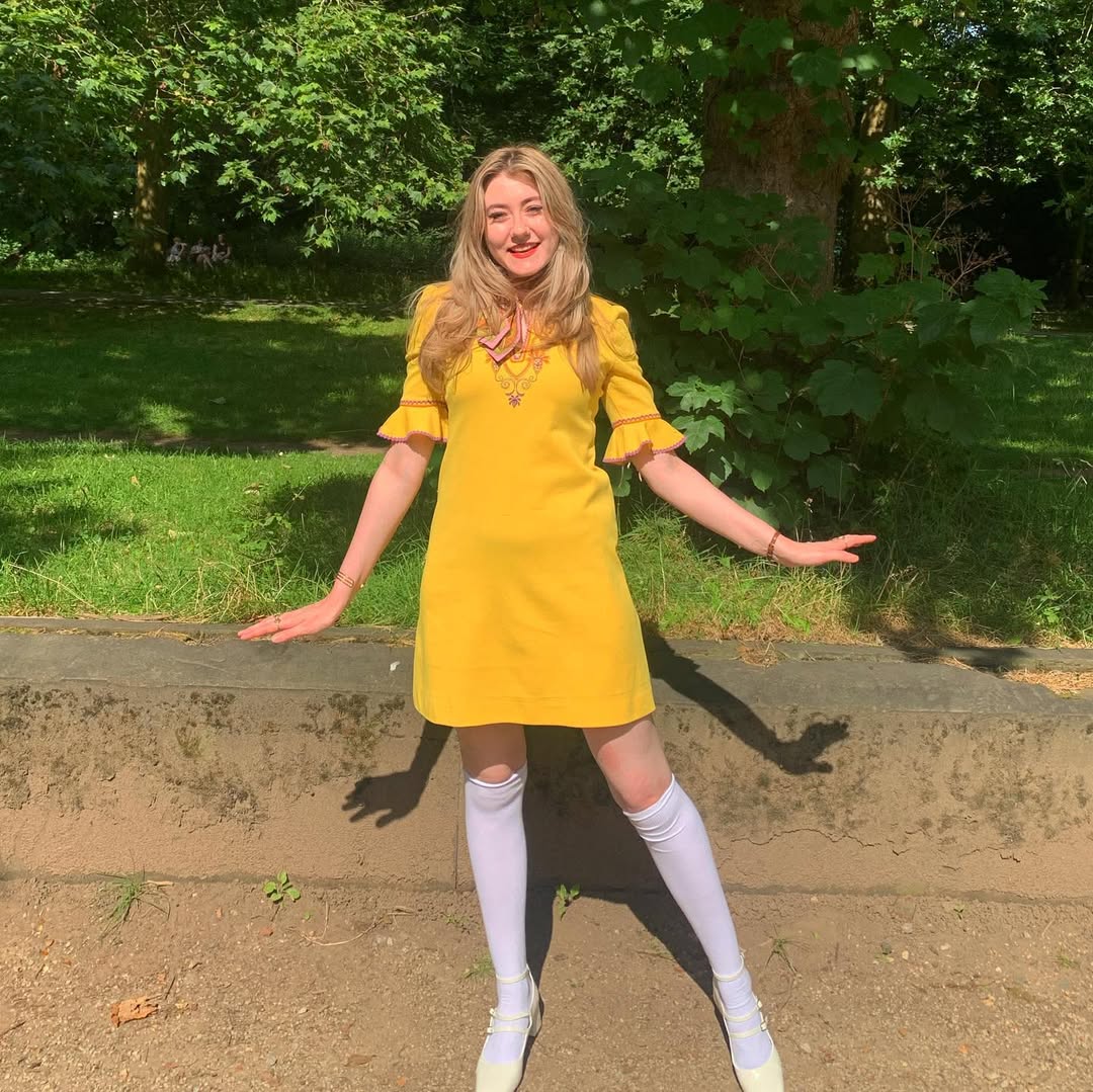 Bright yellow mini dress with playful accessories