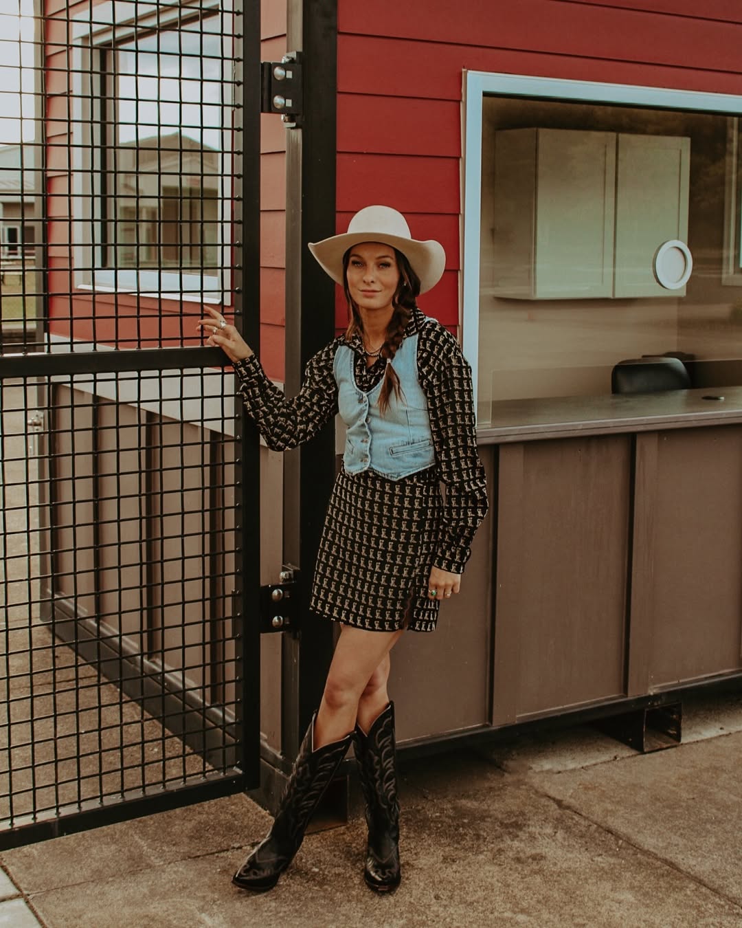 Chic cowgirl look with denim vest and dress