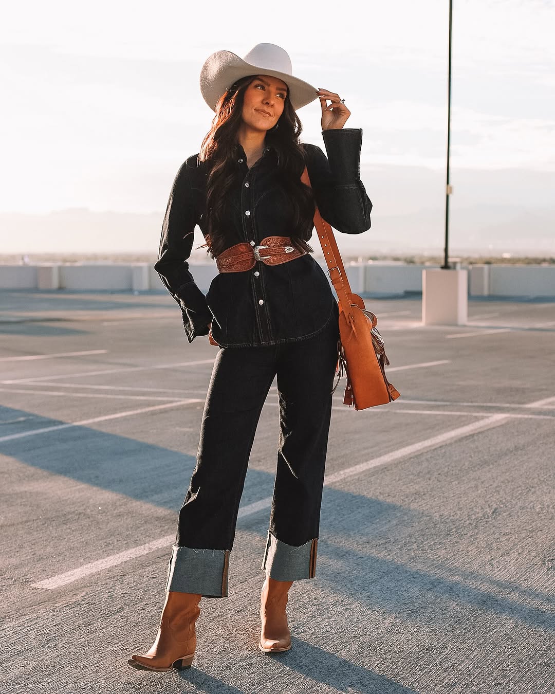 Chic denim cowgirl look with a stylish hat