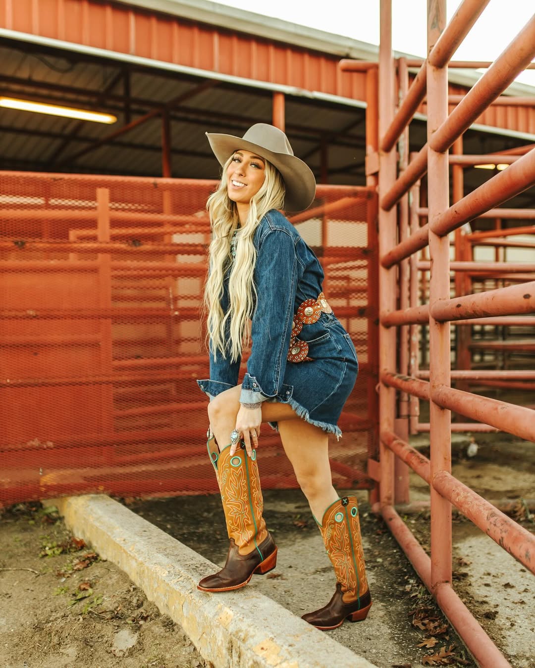 Chic denim dress paired with stunning cowboy boots