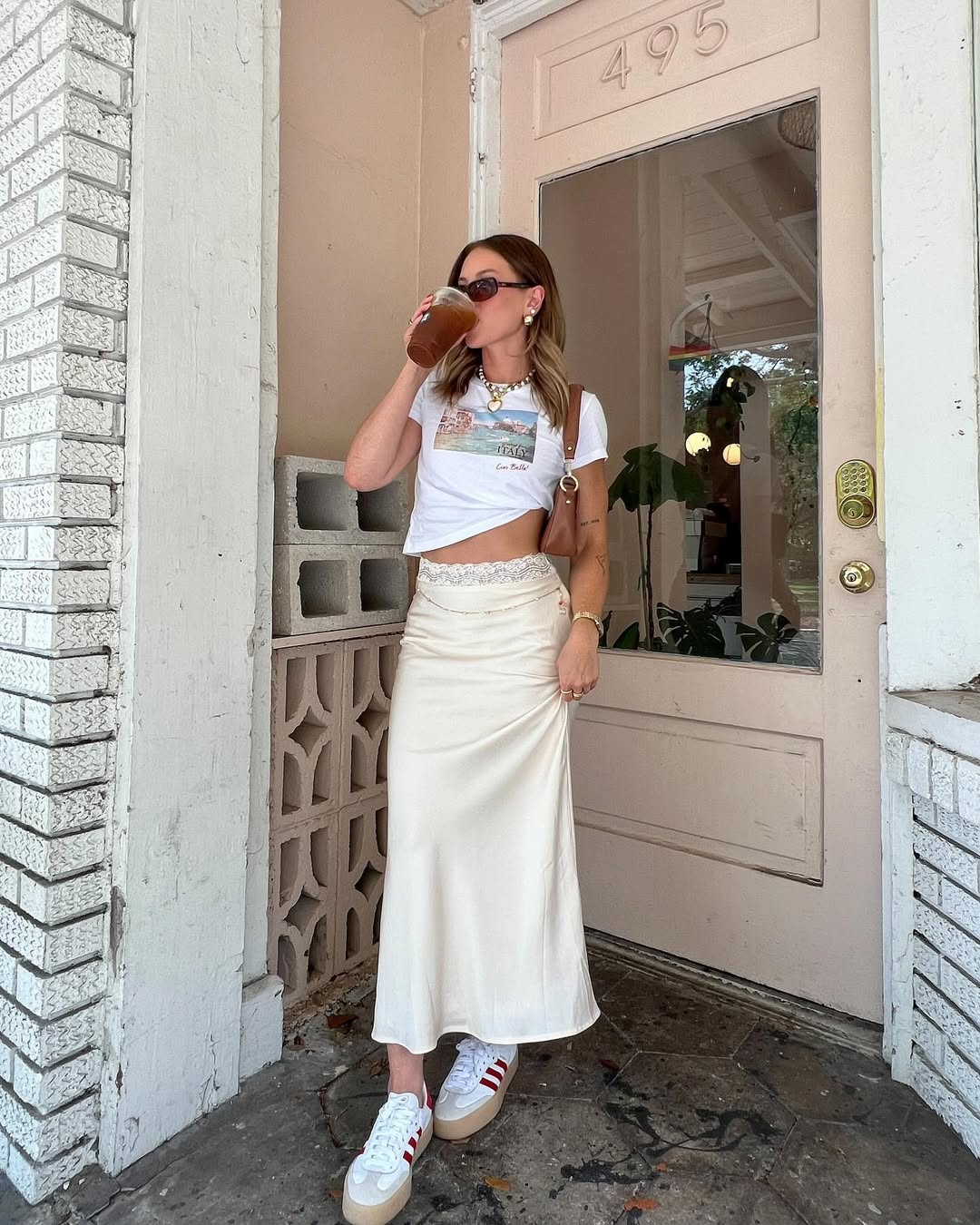 Chic white skirt with graphic tee ensemble